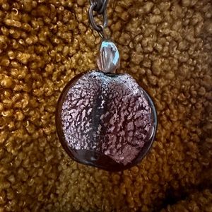 Purple glass tree of life pendant on 18 inch chain.